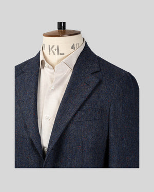 Lapel, shoulder and chest pocket details of Zero Blue Donegal Jacket